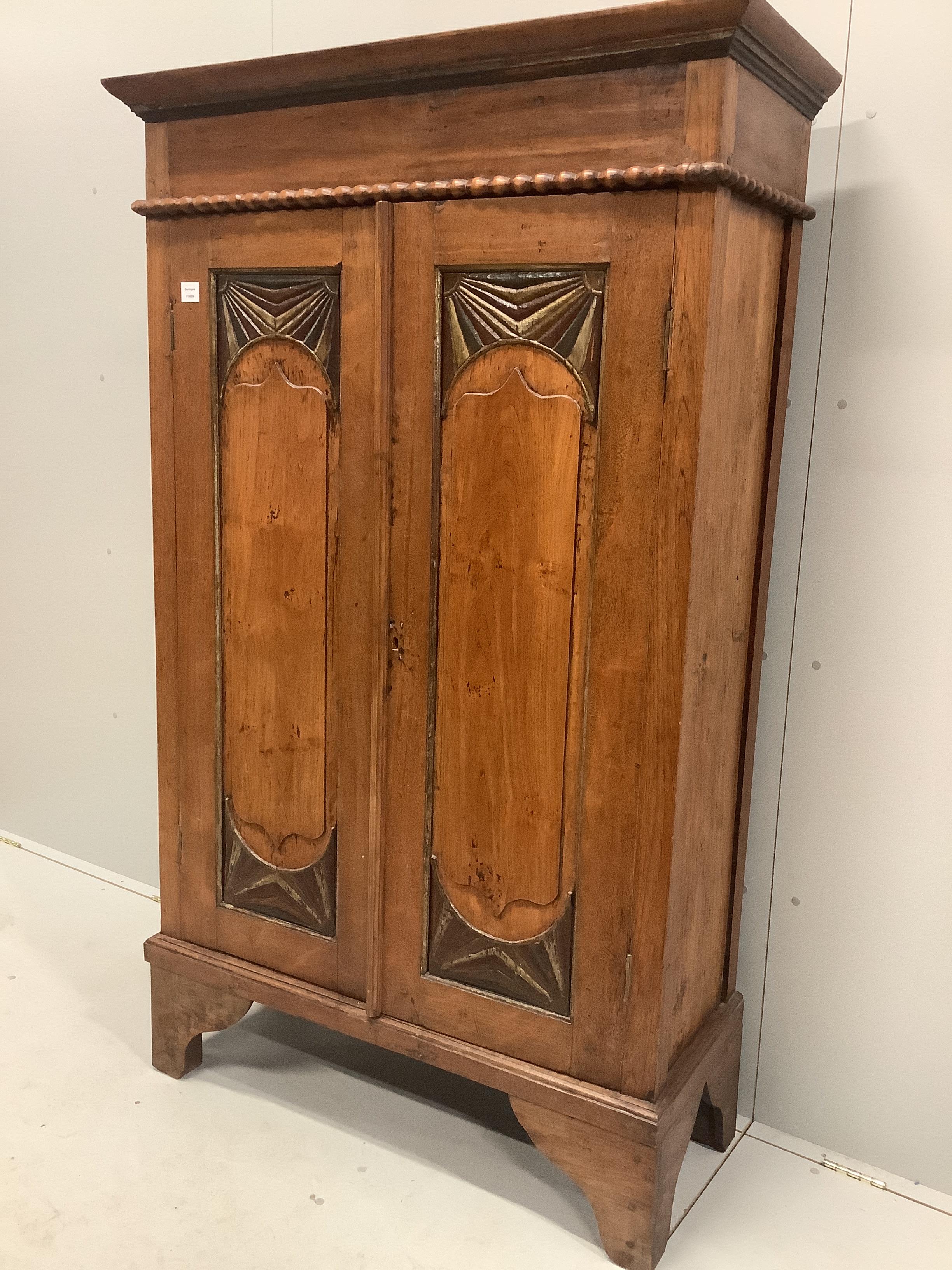 An Anglo-Burmese painted hardwood two door wardrobe, width 110cm, depth 43cm, height 181cm